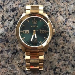 Nixon gold and emerald watch